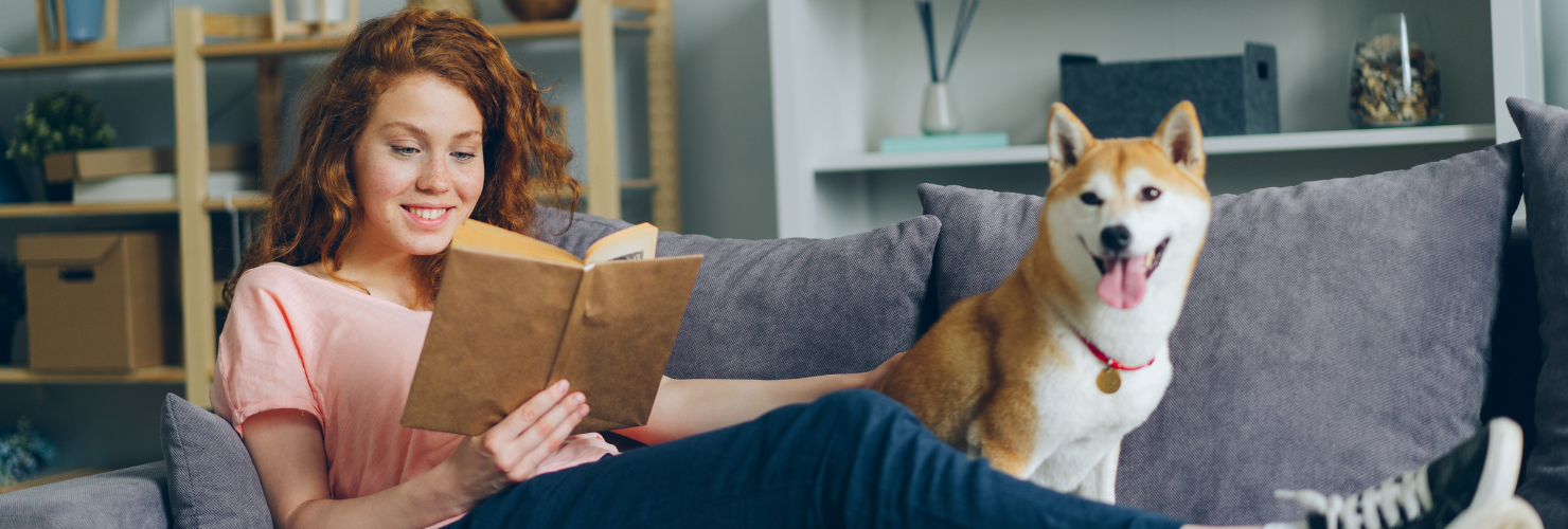 woman reading dog